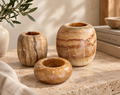  alabaster candle holders. Unique stone patterns, warm earthy tones, and timeless elegance for luxury home decor.